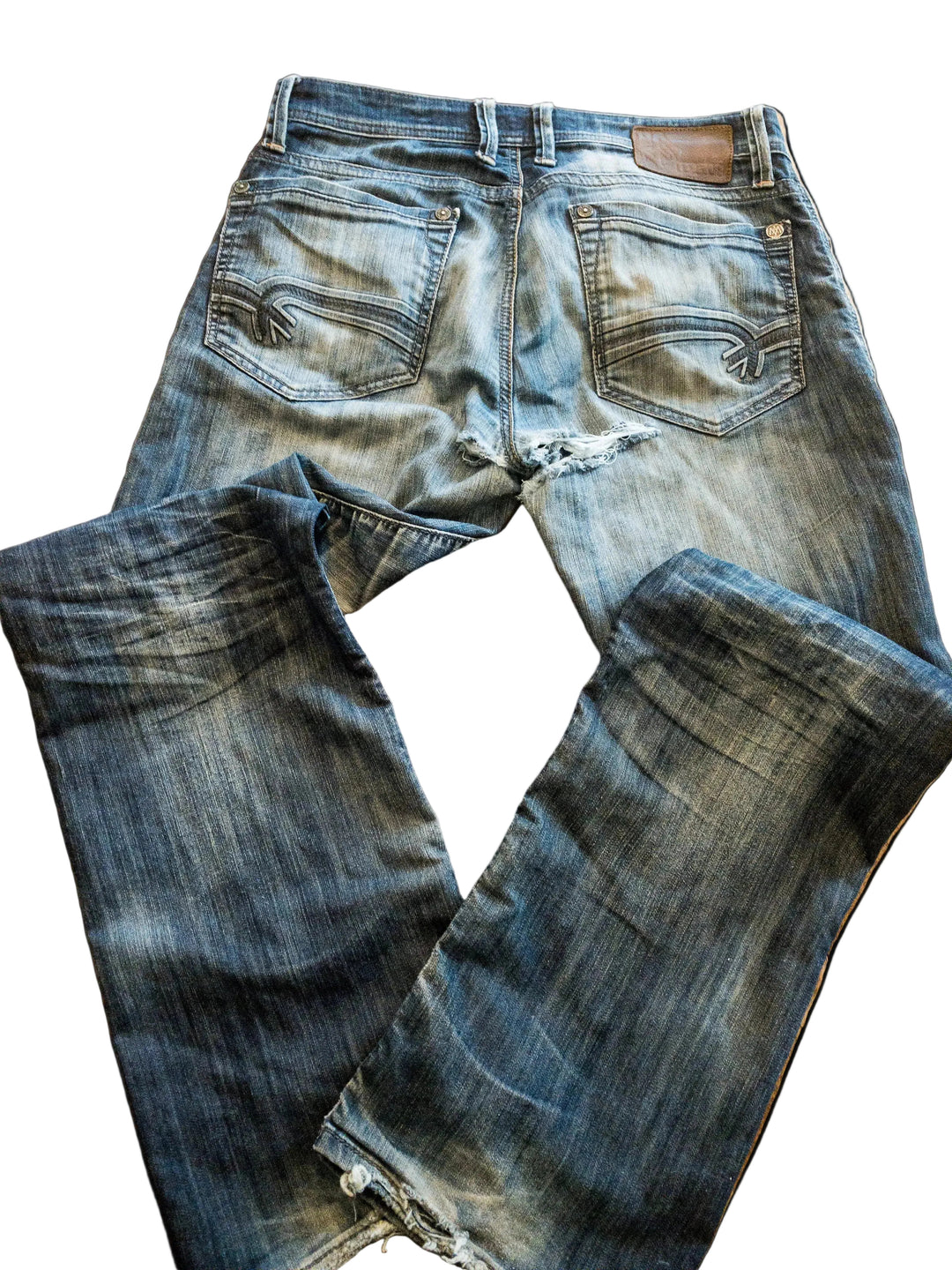 Pair of damaged blue jeans